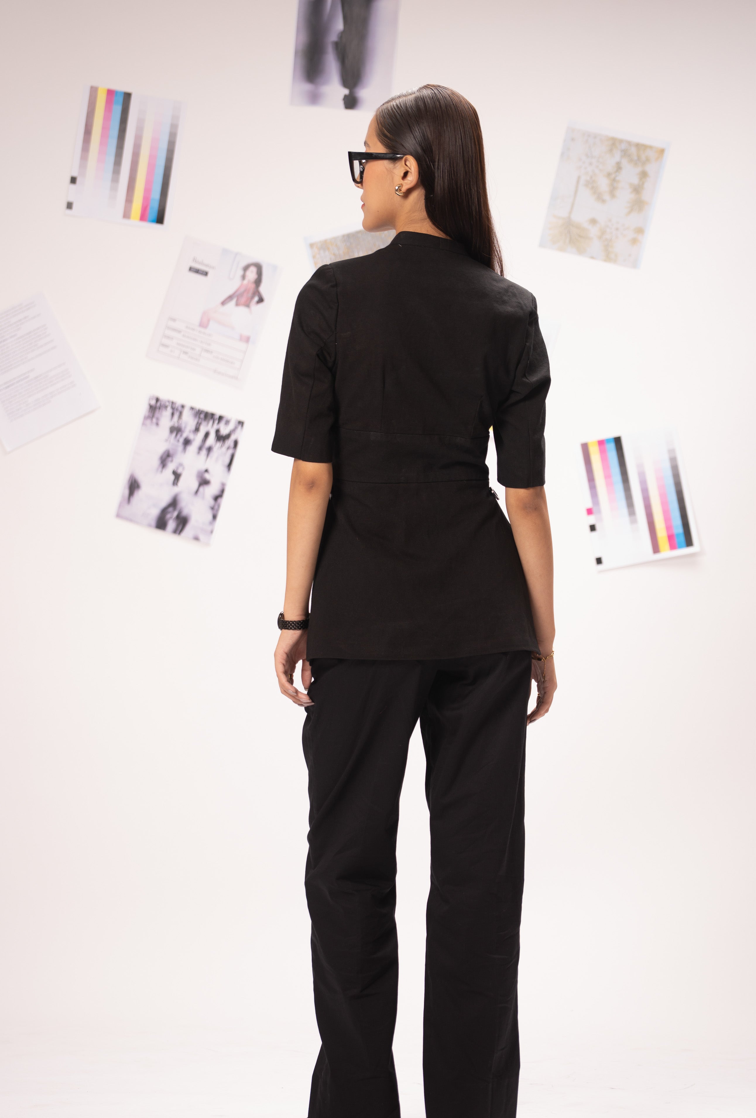 All Hearts No Spades luxury women’s black top with half sleeves, shoulder pads and minimalist tailoring – quiet luxury premium clothing.