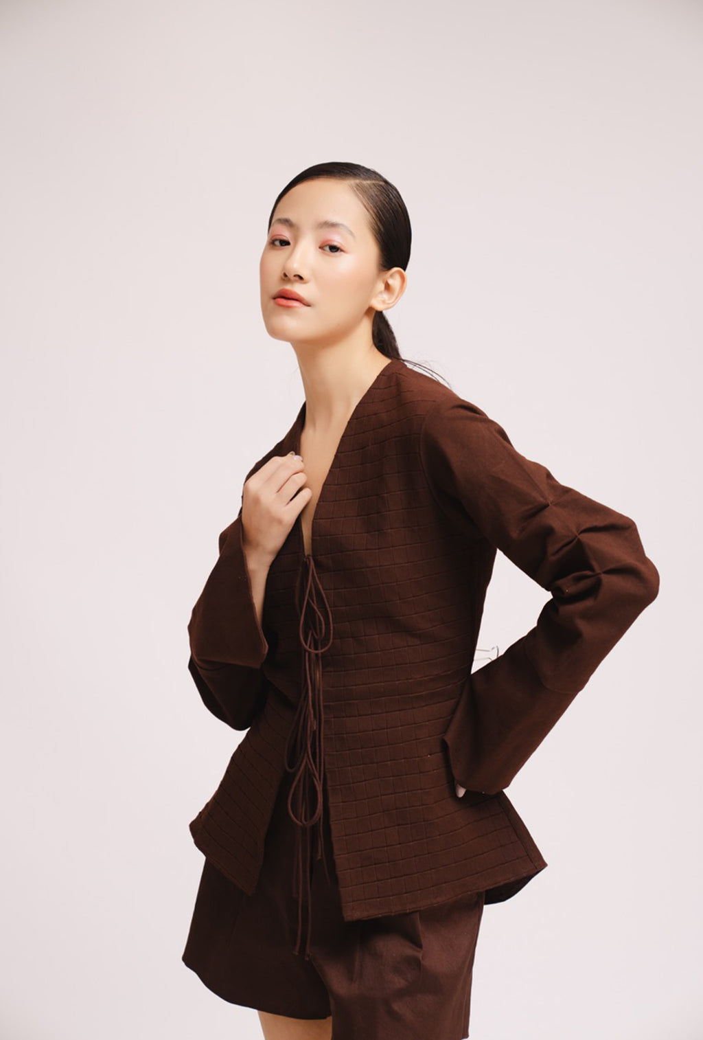 Luxury women’s brown tie up top with bell sleeves and front opening – All Hearts No Spades quiet luxury minimalist clothing