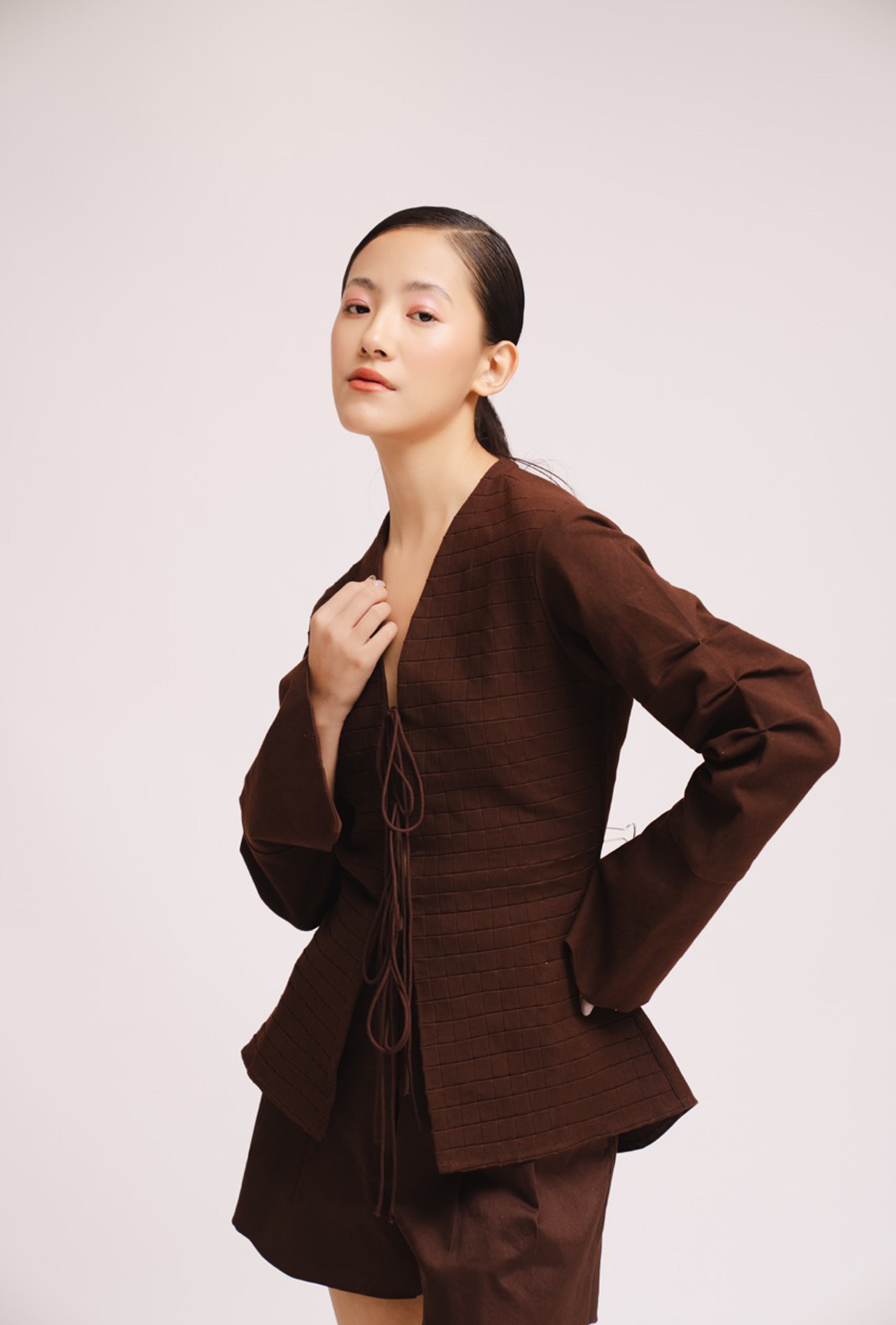 Luxury women’s brown tie up top with bell sleeves and front opening – All Hearts No Spades quiet luxury minimalist clothing