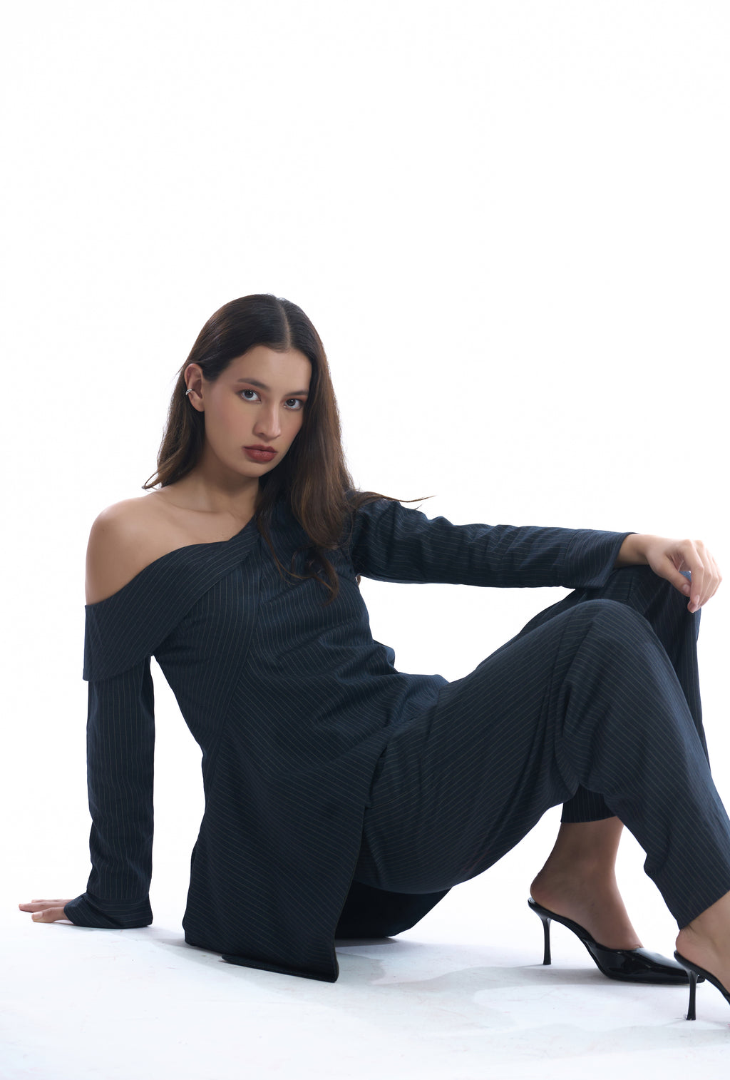 Navy blue pinstripes off-shoulder top on a white background