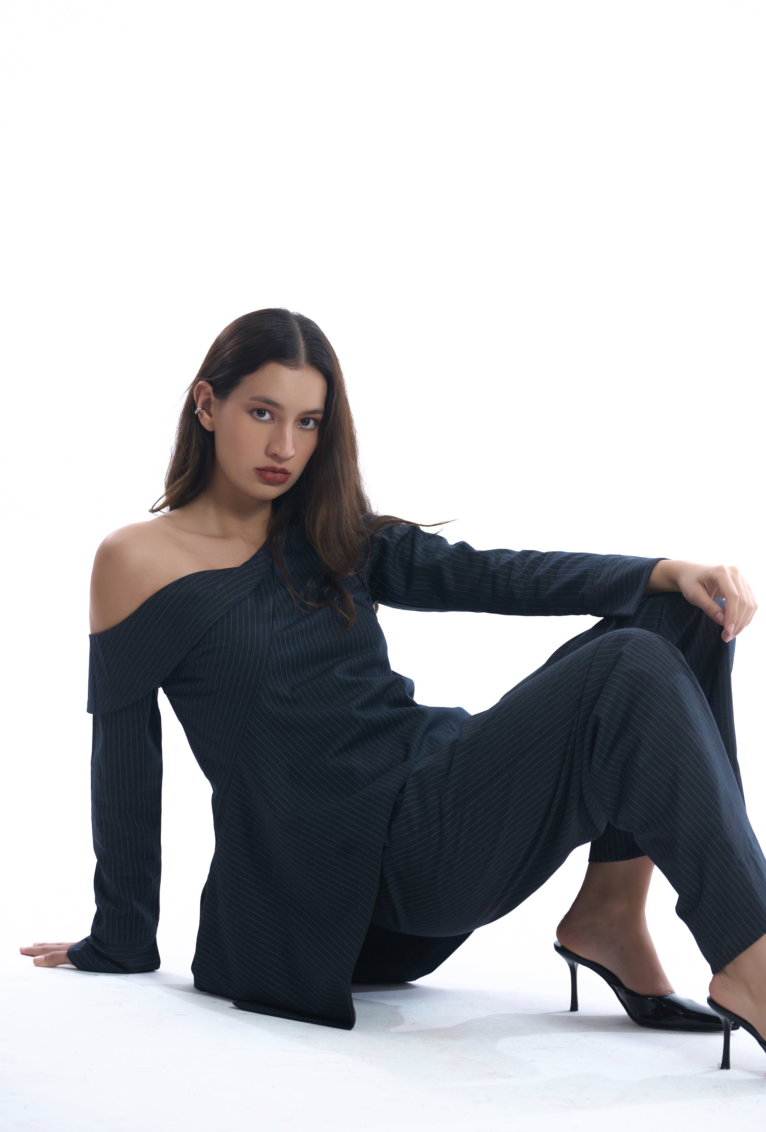 Navy blue pinstripes off-shoulder top on a white background